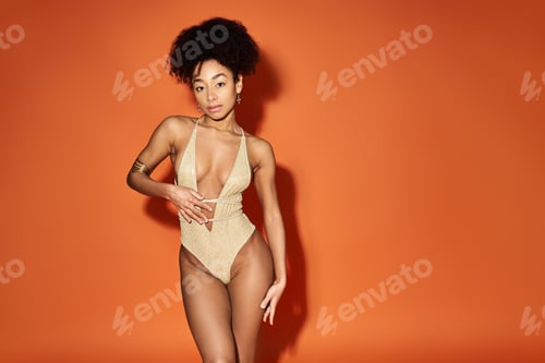 Preview: Vibrant Bikini Beauty on Orange Canvas