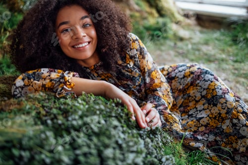 Preview: Fashion and beauty shooting a charming mixed race girl in a long dress