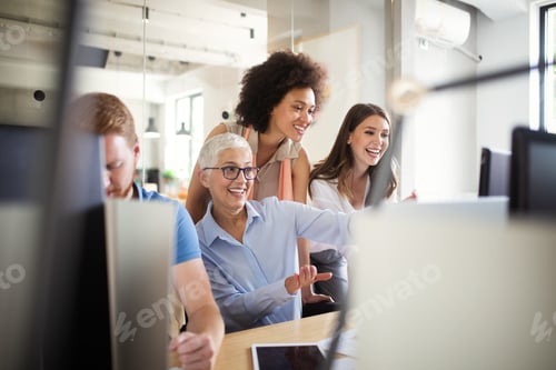 Preview: Programmers cooperating at IT company developing apps