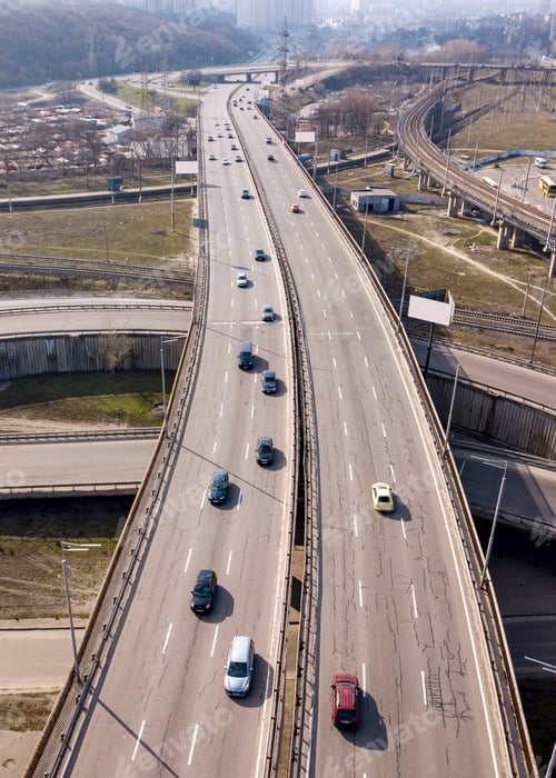 Preview: Aerial view from drone traffic overpass with moving cars on an asphalt road in a sunny day Kiev
