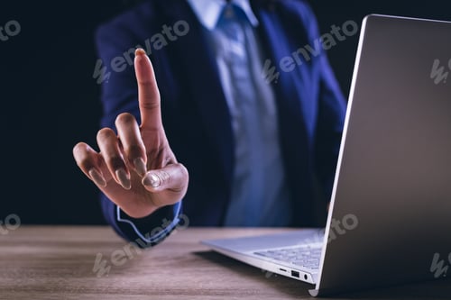 Preview: Biracial businesswoman using laptop and holographic display with copy space