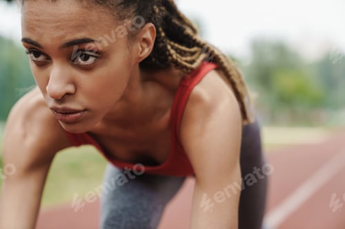 Preview: Fit african young woman jogging