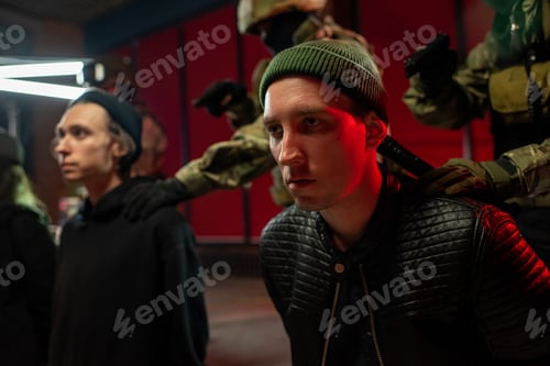 Preview: Men in military outfit arresting hackers