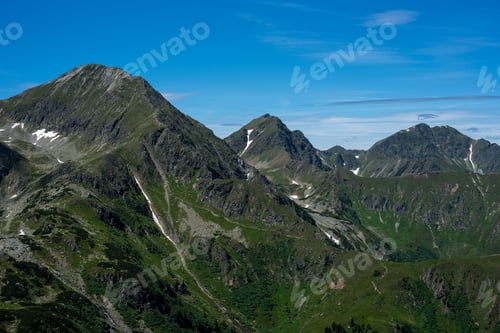 Preview: The mountain peaks in summer