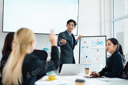 Preview: Business professional presenting data insights to a diverse team during a corporate meeting.