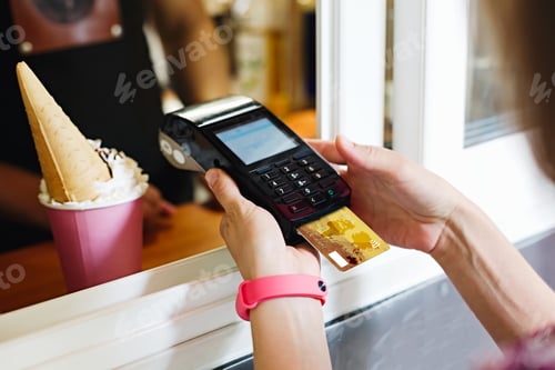 Preview: Person paying bill in cafe