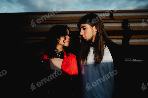 Preview: Long haired man and woman standing near train