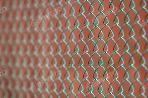 Preview: Close-up of isolated painted simple geometric black iron metal wire chain link fence