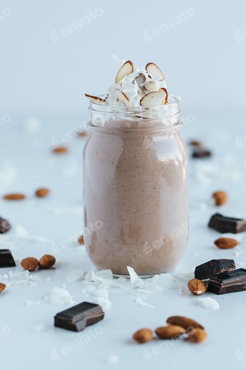 Preview: Vertical shot of the chocolate protein shake in a jar with the chocolate slices and jar