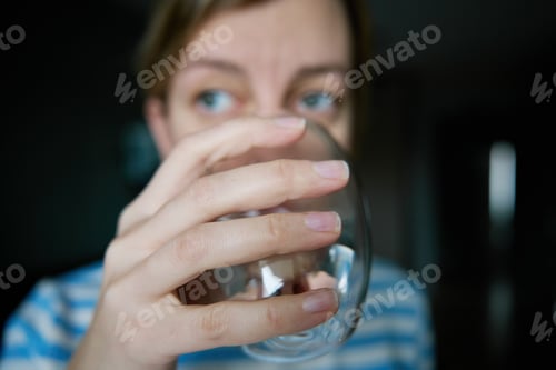 Preview: Woman drinks clean water from glass