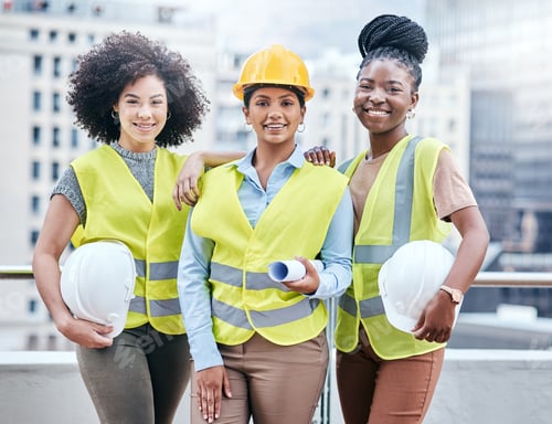 Preview: Portrait of a group of confident young businesswomen working at a construction site