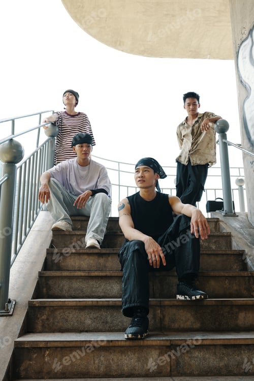 Preview: Four Friends Posing on Outdoor Staircase