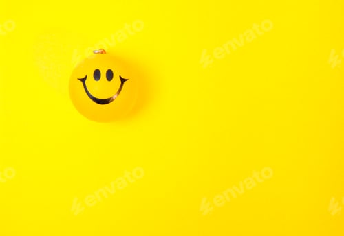 Preview: Photo of a yellow smiley face on paper background
