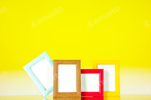 Preview: front view different picture frames with colored corners on yellow background picture family memory