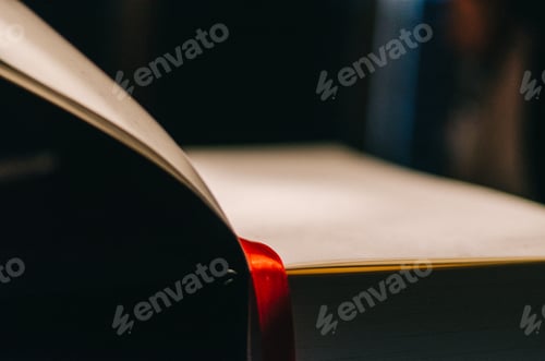 Preview: Old book with red satin bookmark