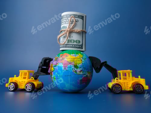 Preview: Excavator pushing earth globe and banknotes on blue background. Business concept.