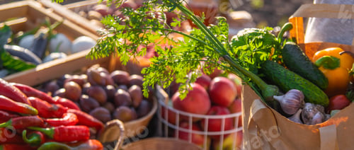 Preview: A woman buys fruits and vegetables at a farmers market. Selective focus.