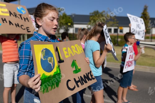 Preview: Group of elementary school pupils walking on a protest march