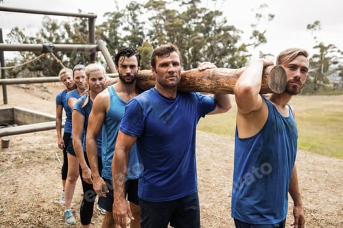 Preview: People carrying a heavy wooden log during boot camp