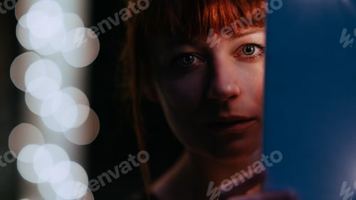Preview: Cinematic close up of ginger woman with green eyes in the darkness