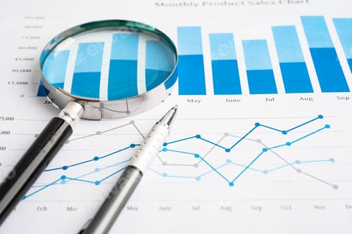 Preview: Magnifying glass on spreadsheet and graph paper. Financial development, Banking Account