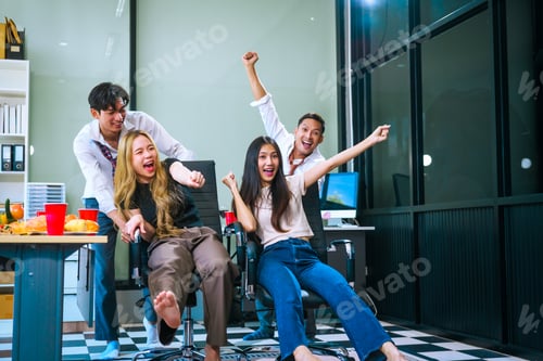 Preview: Four Asian friends, two men and two women, celebrate in an office party. They enjoy a fun-filled
