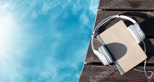 Aperçu: Book and headphones near swimming pool