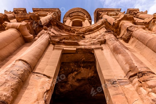Preview: Low angle exterior view of the rock-cut architecture of El Deir or The Monastery at Petra, Jordan.