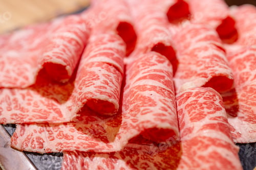 Preview: Slice of fresh raw beef in Hot pot restaurant