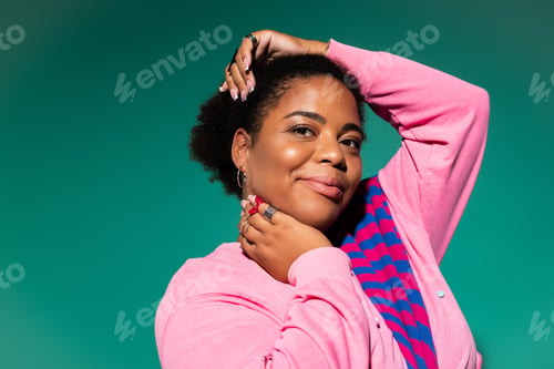 Preview: Stylish plus size african american woman showcases trendy autumn outfit in studio