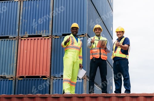 Preview: Team worker stack hand and shake hands to show success work at Container cargo harbor.