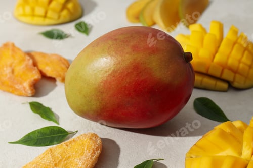 Preview: Fresh and dried mangoes on a white background