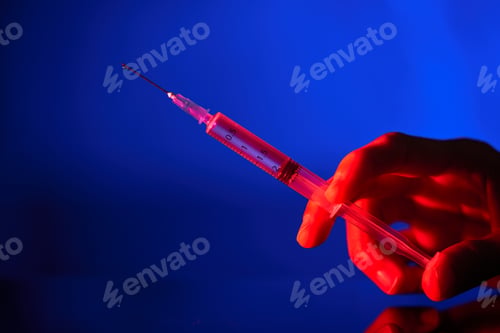 Preview: Faceless person with syringe and vaccine