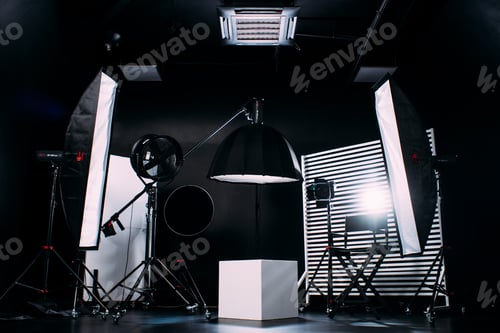 Preview: Modern photo studio with professional equipment. Black cyclorama.