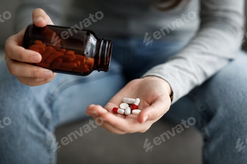 Preview: Hand Pours Pills From Bottle to Hand