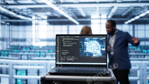 Preview: Focus on laptop used by server farm technicians