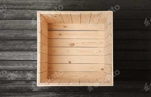 Preview: Open empty wooden crate on black background, top view