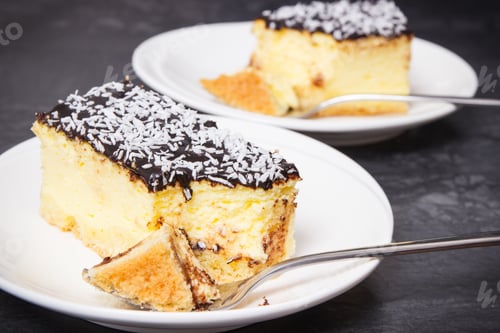Preview: Portion of fresh baked cheesecake on plate. Delicious dessert
