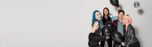 Preview: excited and stylish queer friends holding black balloons on grey background, banner