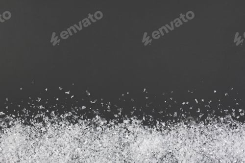 Preview: Confetti or artificial snow on black background with copy space. Flat lay, top view