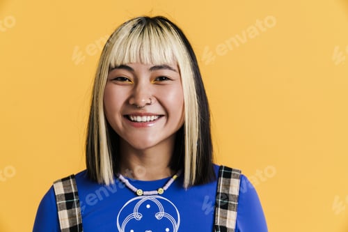 Preview: Asian girl with piercing smiling and looking at camera