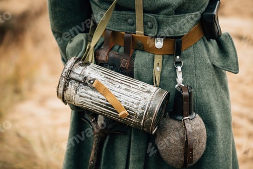 Preview: Re-enactor Dressed As German Wehrmacht Infantry Soldier In World War Ii On Marsch. View From Back