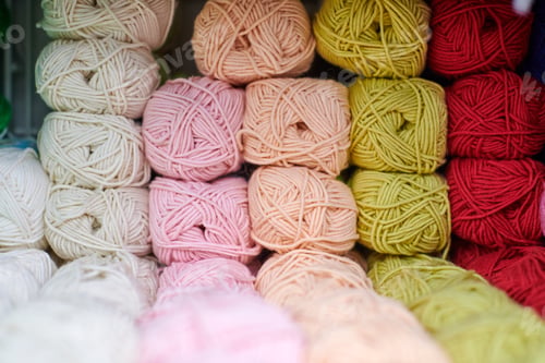 Preview: Yarns or balls of wool on shelves in store for knitting
