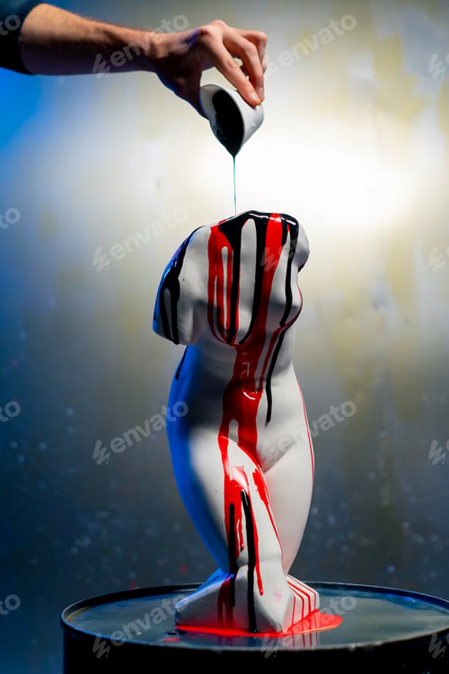 Preview: a white sculpture in the shape of a body stands on a barrel a museum exhibit an artist pours paint