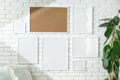 Preview: Varied Sized Photo Frames Displayed on a White Brick Wall