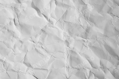 Preview: Close-up of crumpled sheet of white paper. Top view textured uneven paper background
