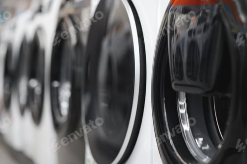 Preview: Rows of modern washing machines in a store