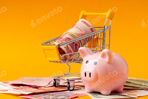 Preview: Piggy bank with money russian rubles, american dollars and ukrainian hryvnia. Savings concept
