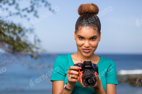 Preview: African American woman photographer taking outdoor photos - Black people