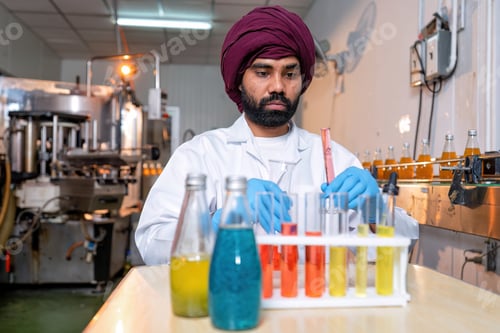 Preview: Beverage laboratory room worker in drink factory take product sample to tube and quality assurance